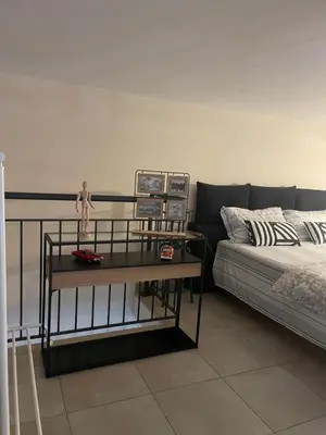Letto o letti in una camera di INDUSTRY HOME