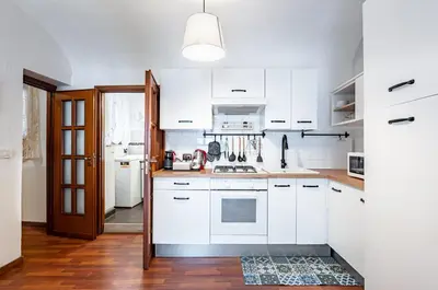 Cucina o angolo cottura di GuestHost - Casa Giuffri - Castello Ursino Flat with Balcony