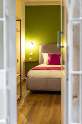 Letto o letti in una camera di The Room Ortigia