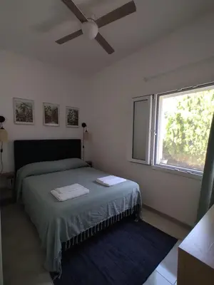 Letto o letti in una camera di Villa Palma Nana al Plemmirio