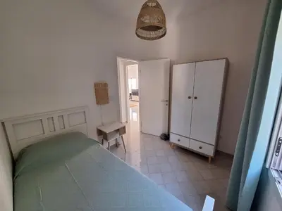 Letto o letti in una camera di Villa Palma Nana al Plemmirio
