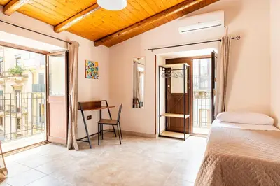 Letto o letti in una camera di Appartamento Catania centro Il 28
