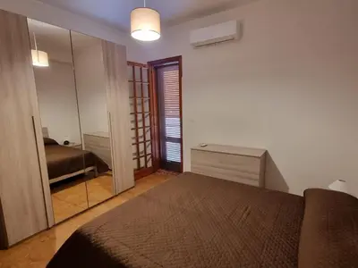 Letto o letti in una camera di Villa Pina Arenella