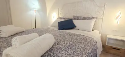 Letto o letti in una camera di Dimora Lucia Majorana