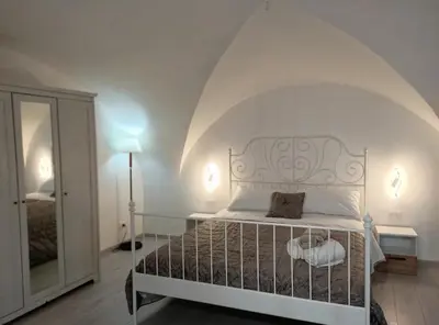 Letto o letti in una camera di Dimora Lucia Majorana