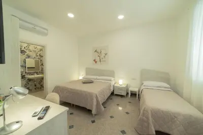 Letto o letti in una camera di B&B MANDORLO BIANCO