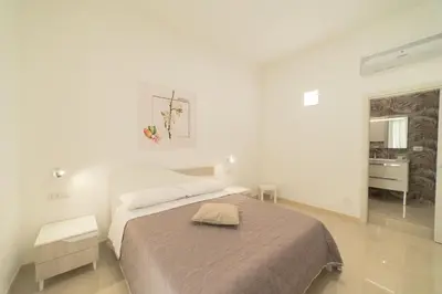 Letto o letti in una camera di B&B MANDORLO BIANCO