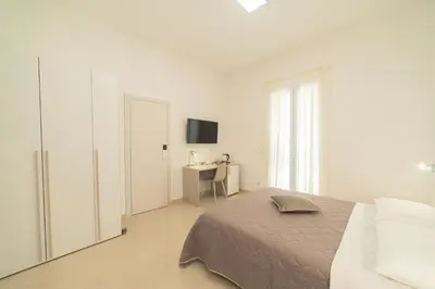 Letto o letti in una camera di B&B MANDORLO BIANCO