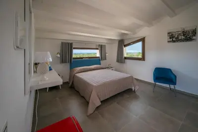 Letto o letti in una camera di Villa Carmiano Luxury bedrooms in Avola in the province of Syracuse with room with swimming pool