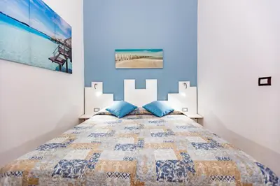 Letto o letti in una camera di Villa Urania by Ortigia Apartments