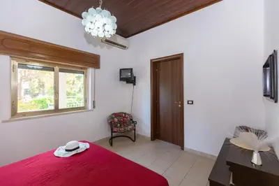 Letto o letti in una camera di Villa Urania by Ortigia Apartments