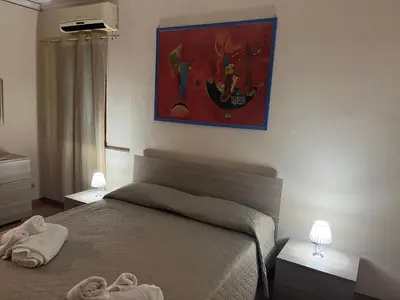 Letto o letti in una camera di Leontini house