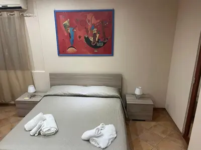 Letto o letti in una camera di Leontini house