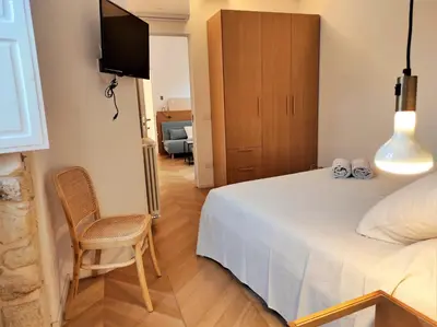 Letto o letti in una camera di Corte Landolina