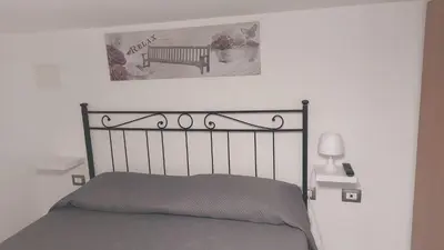 Letto o letti in una camera di Appartamento in centro