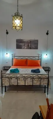 Letto o letti in una camera di MAISON ISOLA DI ORTIGIA