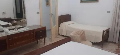 Letto o letti in una camera di Casa della nonna Marina