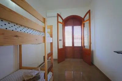 Letto o letti in una camera di Casa di Sara&Anna