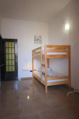 Letto o letti in una camera di Casa di Sara&Anna