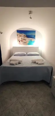 Letto o letti in una camera di IlGrecHouse