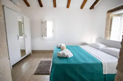 Letto o letti in una camera di Attico Roma