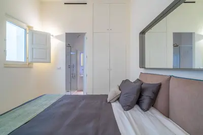 Letto o letti in una camera di Vigliena rooms by Dimore in Sicily