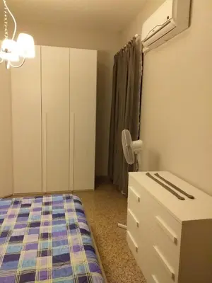 Letto o letti in una camera di TONNARA HOUSE AND HOLIDAY