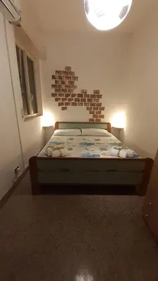 Letto o letti in una camera di TONNARA HOUSE AND HOLIDAY