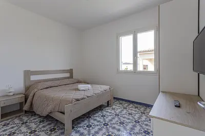 Letto o letti in una camera di Milocca Homes