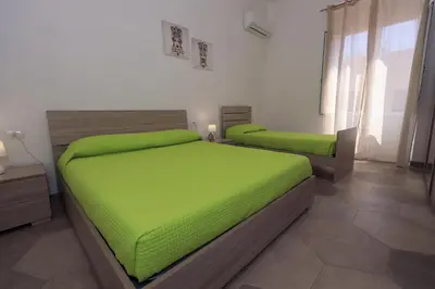 Letto o letti in una camera di Casa Caruso Corso Garibaldi