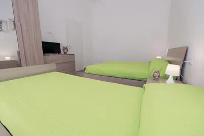 Letto o letti in una camera di Casa Caruso Corso Garibaldi