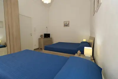 Letto o letti in una camera di Casa Caruso Corso Garibaldi