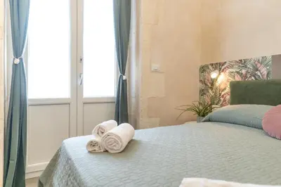 Letto o letti in una camera di GuestHost - Santa Lucia Charming Apartment with Terrace