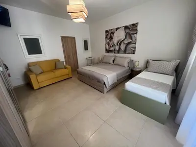 Letto o letti in una camera di Albemarooms