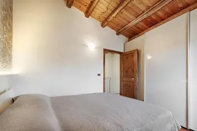Letto o letti in una camera di Domus Heraea