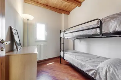 Letto o letti in una camera di Domus Heraea