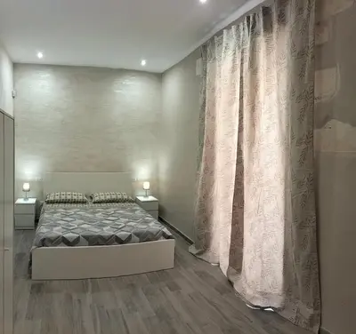 Letto o letti in una camera di Square House Casa Vacanze