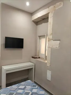 TV o dispositivi per l'intrattenimento presso Square House Casa Vacanze