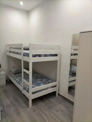 Letto o letti in una camera di Square House Casa Vacanze
