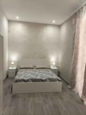 Letto o letti in una camera di Square House Casa Vacanze