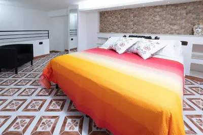 Letto o letti in una camera di Mori Carretti Tamburelli