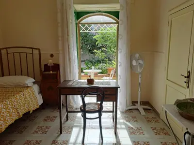 Letto o letti in una camera di Giardino al Corso