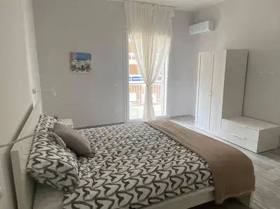 Letto o letti in una camera di Petali di rosa apartment 2 - 600m dal Teatro Greco