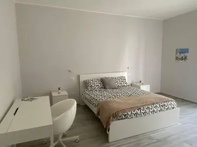 Letto o letti in una camera di Petali di rosa apartment 2 - 600m dal Teatro Greco