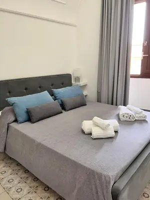 Letto o letti in una camera di B&Beach Ospitalità Siciliana