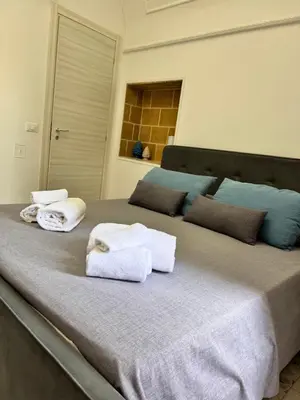 Letto o letti in una camera di B&Beach Ospitalità Siciliana