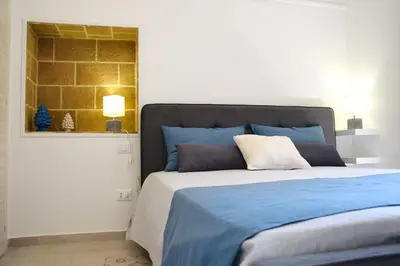 Letto o letti in una camera di B&Beach Ospitalità Siciliana