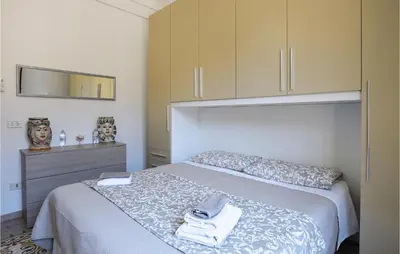 Letto o letti in una camera di Happy Holiday