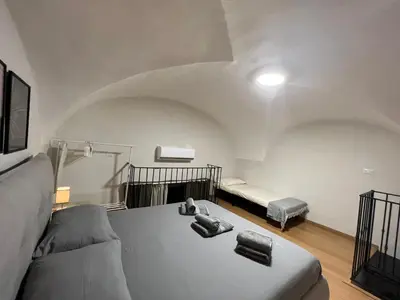 Letto o letti in una camera di Almond Apartment Catania