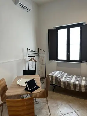 Letto o letti in una camera di San Damiano Inn